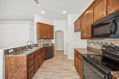 Kitchen featuring light wood-type flooring, sink, 