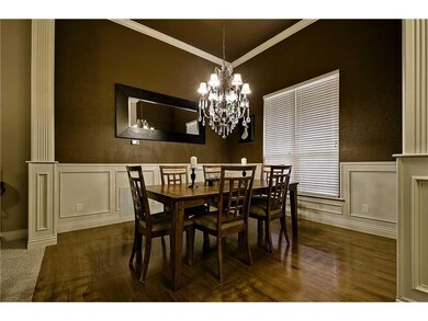 Dining Room. All dressed up with incredible detail & hardwood flooring!