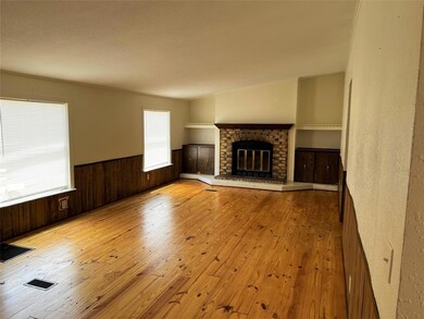 wood burning fireplace in second living area