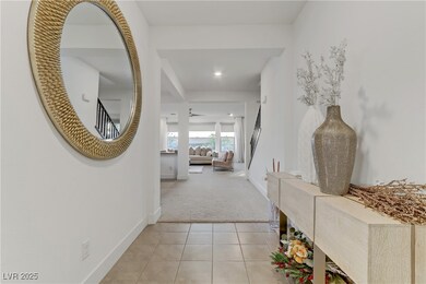 Hallway featuring light colored carpet, baseboards