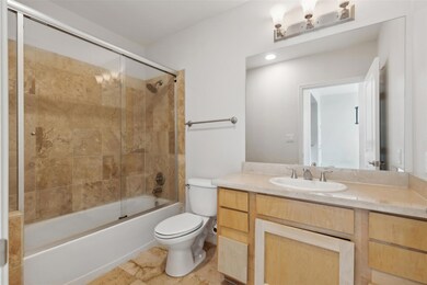 Full bathroom featuring enclosed tub / shower comb