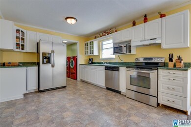 Plenty of cabinet space in this dine in kitchen.