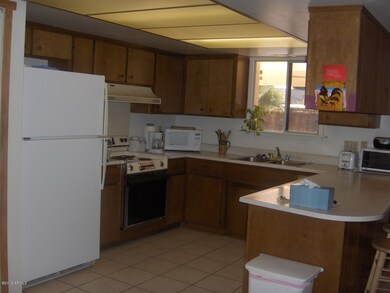 Kitchen overlooking the pool & patio