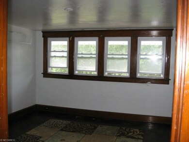 Living room in upstairs unit. All hardwood floors.