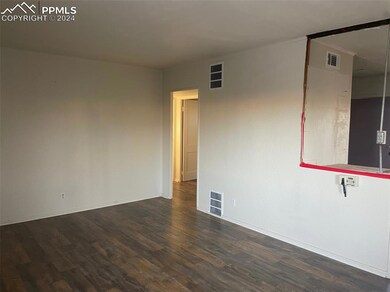 Spare room featuring dark hardwood / wood-style fl