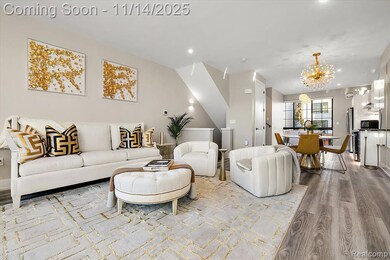 Living area with a chandelier, wood finished floors, and recessed lighting