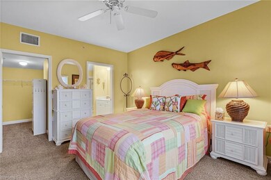 Carpeted bedroom featuring connected bathroom, a w