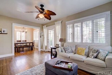 Living room with front door entry and formal dinin