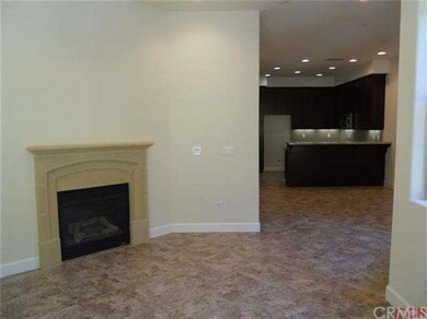 Beautiful tile flooring downstairs, corner firepla
