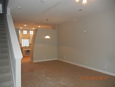 2nd floor dining area. Wood floors are covered.
