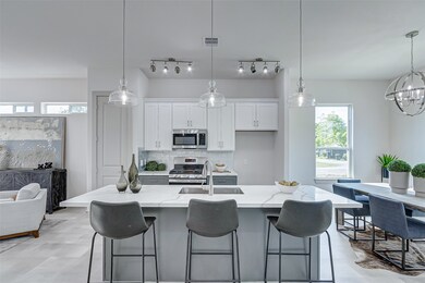 Large kitchen island with stainless steel applianc