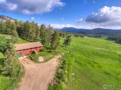 Evergreen trees surround the home