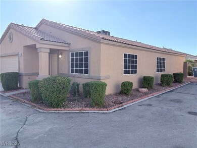 View of home's exterior with stucco siding and a tiled roof