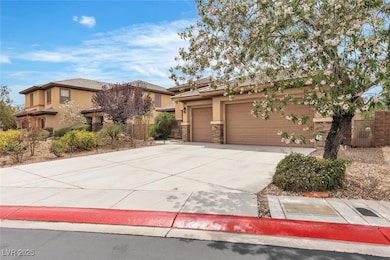 View of front facade with stucco siding, driveway,