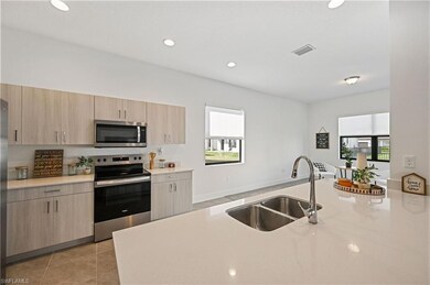 Kitchen featuring visible vents, light brown cabin