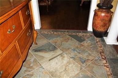 Stunning natural stone tile in large foyer!