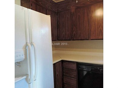 Property Photo. Kitchen w. refrigerator
