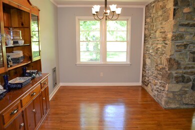 Dining room with built-in china cabinet and open to living rm and kitchen