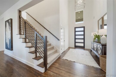 Two story entry with hardwoods, closet, and lots o