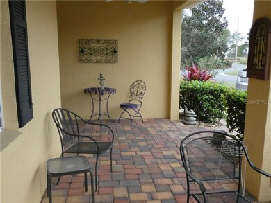 Front porch has window into guest cottage.