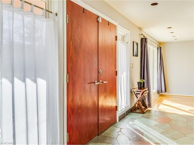 Double door foyer entry with slate floor.
