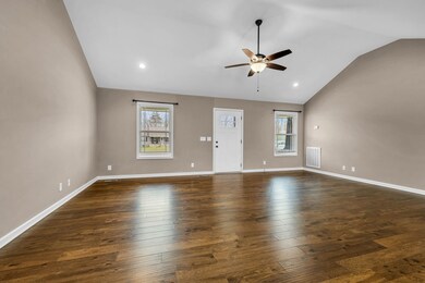 The living room boasts grandeur with its vaulted ceilings, creating an expansive atmosphere filled with airiness and light.  418 N Ballard Rd  Manchester, TN 37355