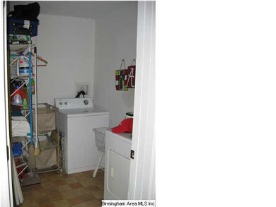 large laundry room just off of kitchen has extra s