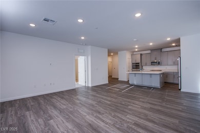 Unfurnished living room with dark wood-style floor