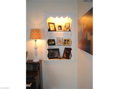Charming built-in with decorative trim and lighted