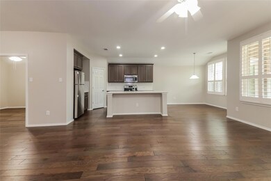 Unfurnished living room with dark hardwood / wood-