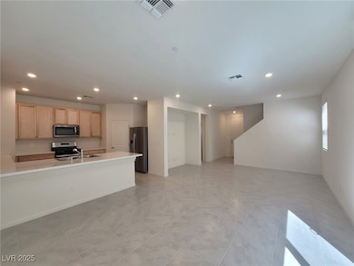 Kitchen featuring appliances with stainless steel