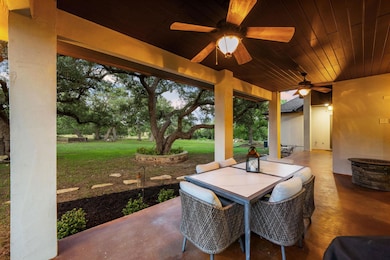 View of patio / terrace with ceiling fan and outd