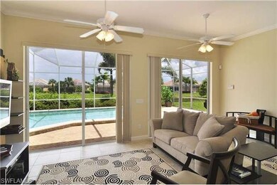 Extended living area view to custom pool and lake beyond