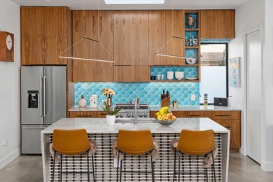 Kitchen featuring high end refrigerator, modern c