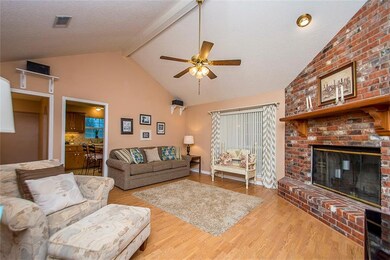 Family room with vaulted ceiling and fireplace