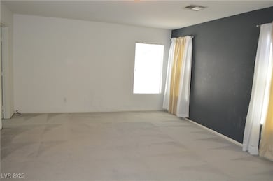 Spare room featuring light colored carpet