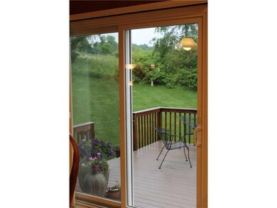 Exterior Front. Brand New Sliding Glass Doors to T