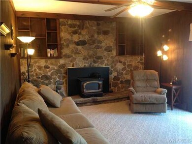 Family Room. Rustic Stone wood burning Fireplace, 