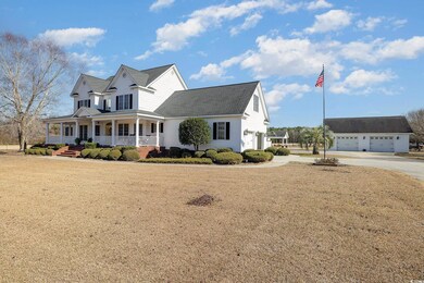 View of front of house with covered porch and a fr