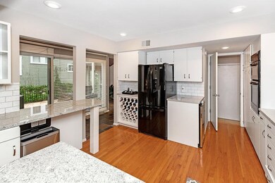 White bright kitchen that connects smoothly to the