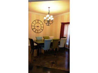 Dining Room. Scored floors and crown molding