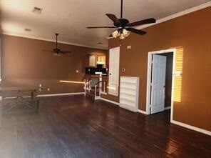 Living area with dark wood-style flooring, crown molding, and a ceiling fan