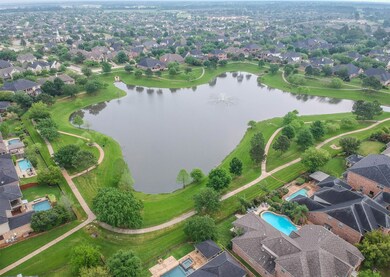 Fun and Fishing Friendly Community Lake! Path entrance is only 1 block away! What a lovely way to unwind while still getting in some exercise...or just a peaceful setting to simply sit, relax and soak it all in....