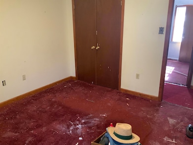 Unfurnished bedroom featuring carpet