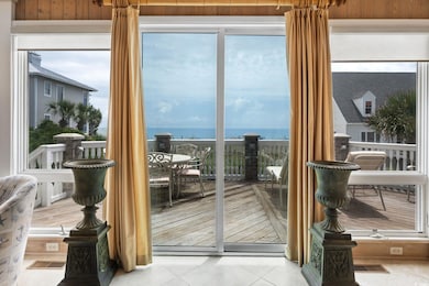 Entryway featuring a water view and light tile pat