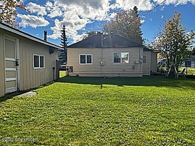 back yard looking at rear of home