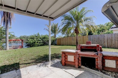 Covered back patio with grilling area and water vi