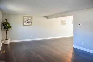 The spacious living room opens to the dining area.