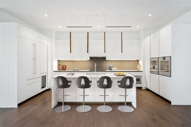 The gourmet kitchen has a fresh, cheerful color pa