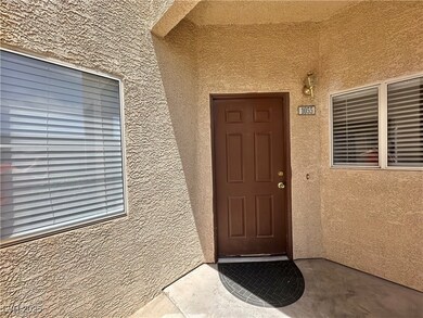 View of exterior entry with stucco siding